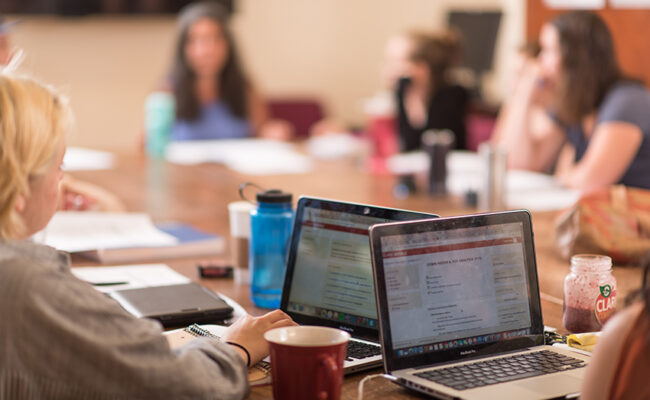 International Development, Community and Environment House - - classroom with laptop on table