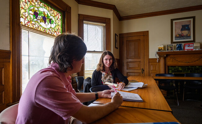 Anderson House - students in room with stain glass