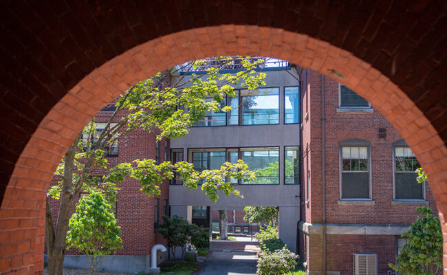 arch window looking out of Carlson Hall to Sackler