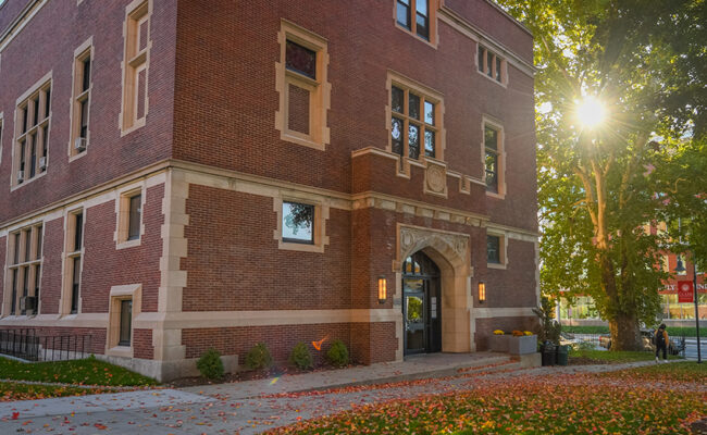 Fall scene with pumpkins sitting out in front of Geography Building