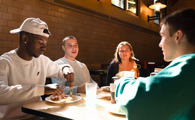 Higgins University Center students eating at table