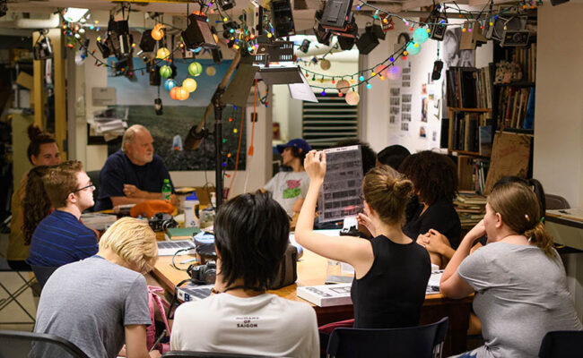 Traina Center for Arts - students looking at film