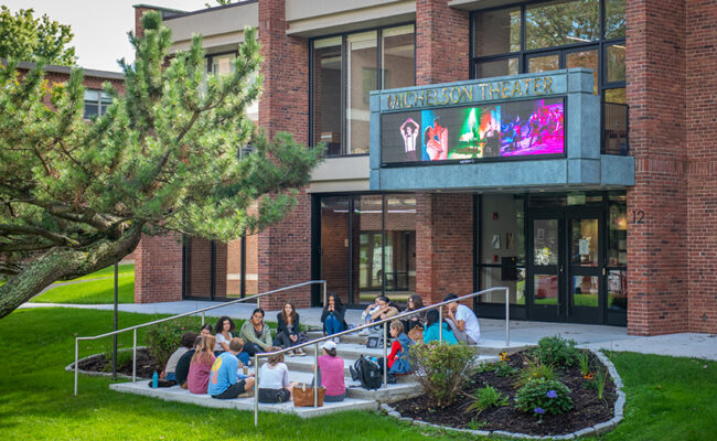 students sitting on zen garden