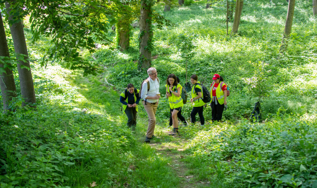 John Rogan gives HERO students a tour of the Hadwen Arboretum.