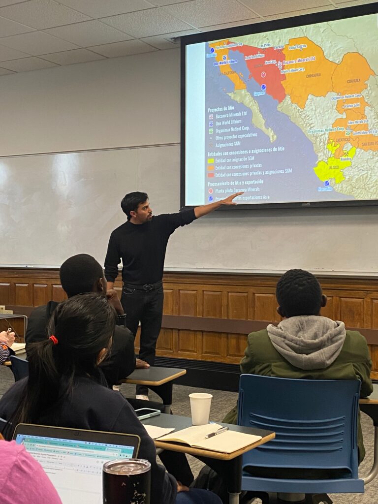 Professor showing maps