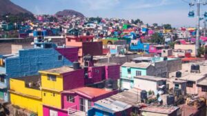large water barrels on roofs of houses in Mexico City