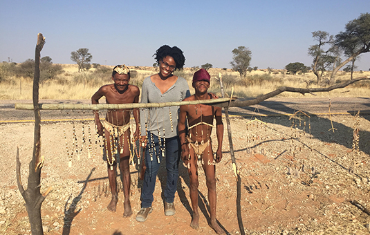 student with African tribe