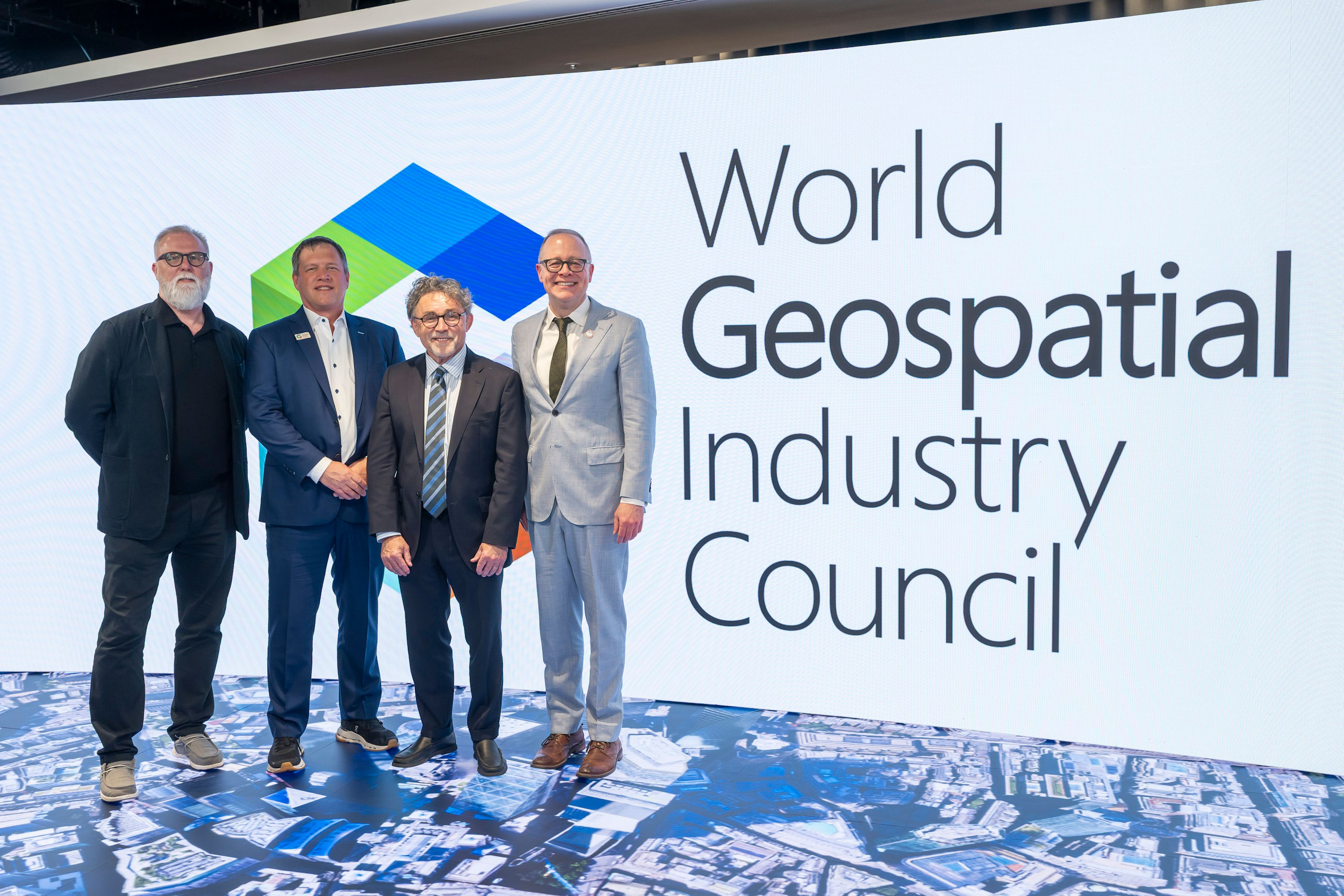 Panelists at the launch in London for the new professional geospatial degree included, from left, Mark Coates, vice president of infrastructure policy advancement, Bentley Systems; Aaron Addison, executive director of the World Geospatial Industry Council; John Wilson, founding director of the Spatial Sciences Institute at the University of Southern California; and Lou Leonard, inaugural D.J.A. Spencer Dean of Clark’s School of Climate, Environment, and Society.