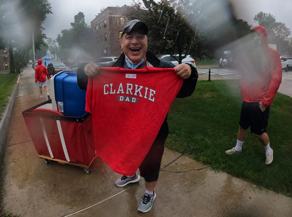 Family member of new Clark student proudly displays his Clarkie D shirt.