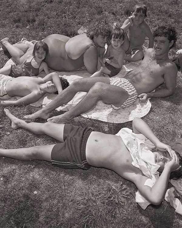 A family sunbathes at Bell Pond, 1983