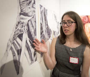 Amy Yeager points at drawing