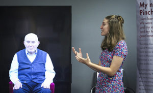 Casey Bush using an interactive technology