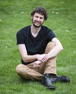 Dexter Locke sitting on grass