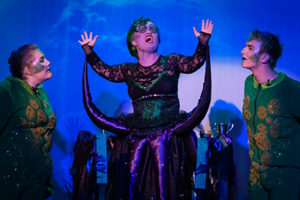 students in costumes on stage