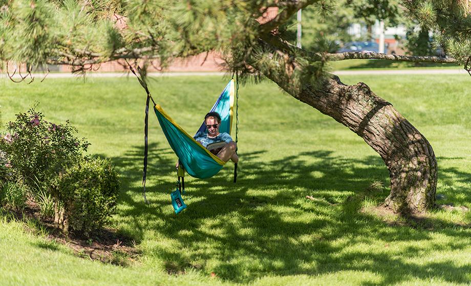 student laying in canopy