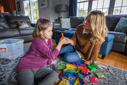 Allegra Denehy '95 and her daughter, Tessa, play at their house