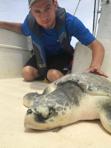 Anthony Himmelberger with a sea turtle