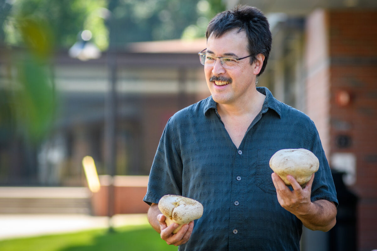 David Hibbett holding mushroom