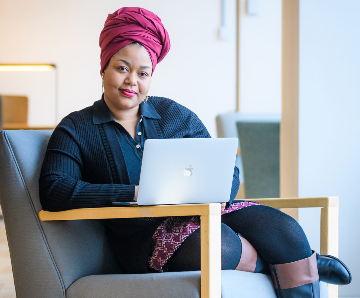 Natalia Warburton sitting in a chair with a computer