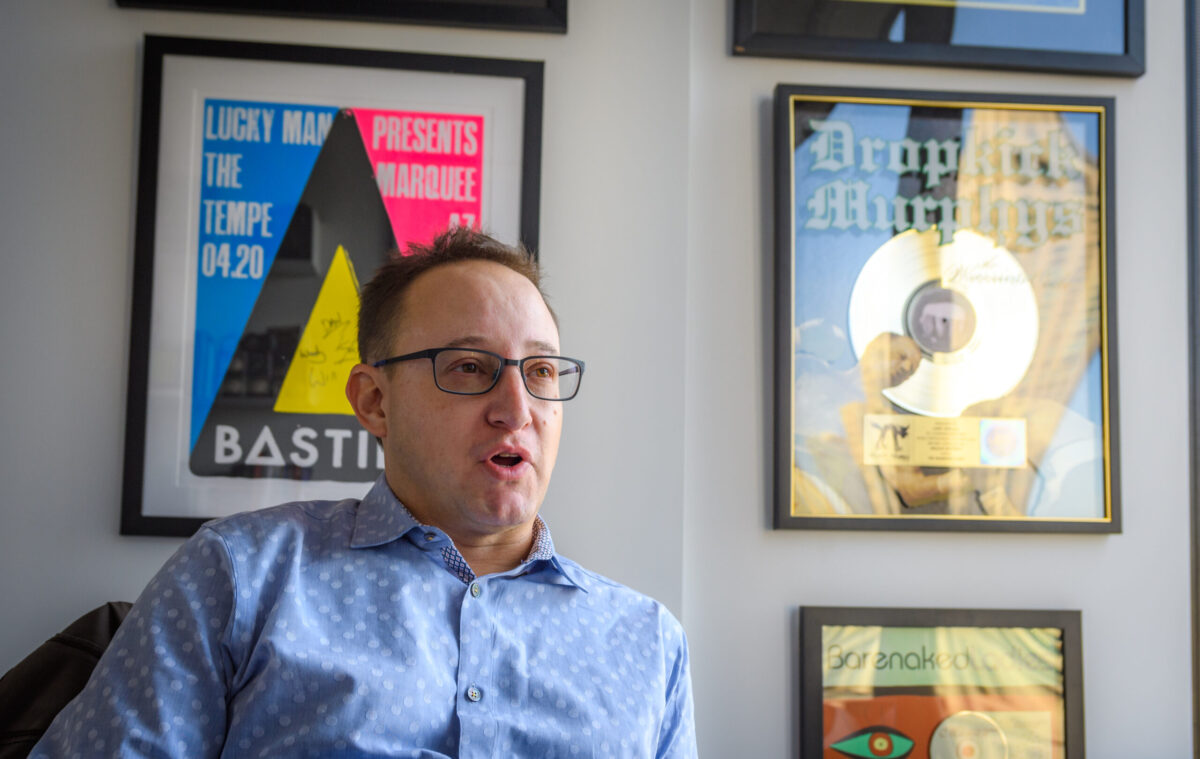 Larry Webman in office with music recor