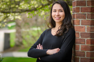 Rachael Chen standing, with arms crossed