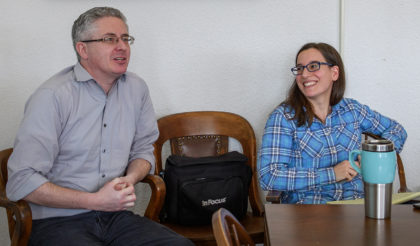Professors John Rogan and Florencia Sangermano seated at table