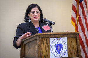 Marianne standing at podium