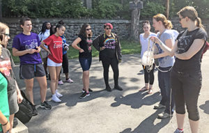 Girls standing around instructor