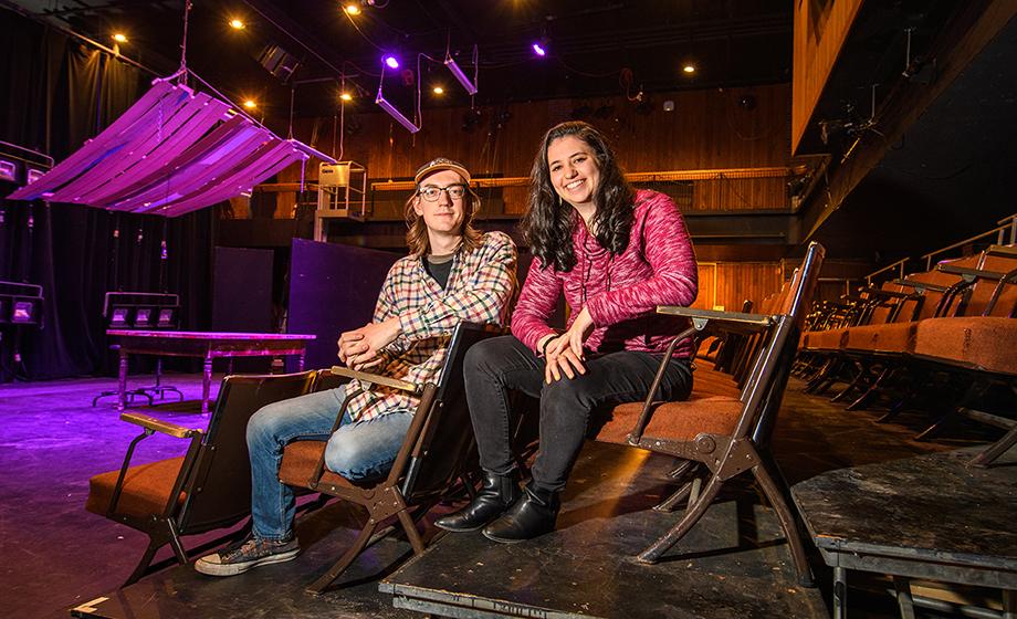 Jaime Silverman and Liam Day sitting in theatr