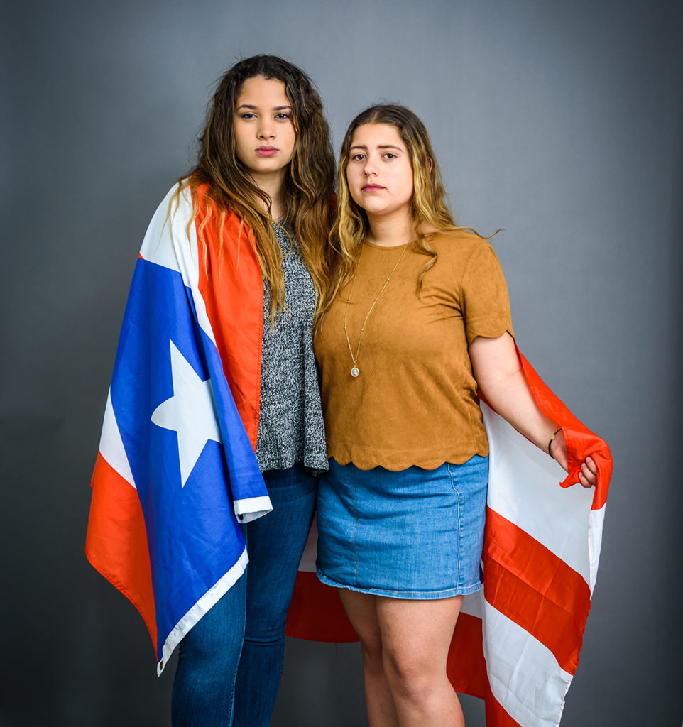 Students wrapped in Puerto Rico flag