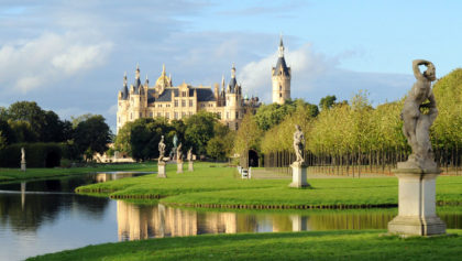 Schwerin Schloss, or Castle, in Germany, with pond in foreground