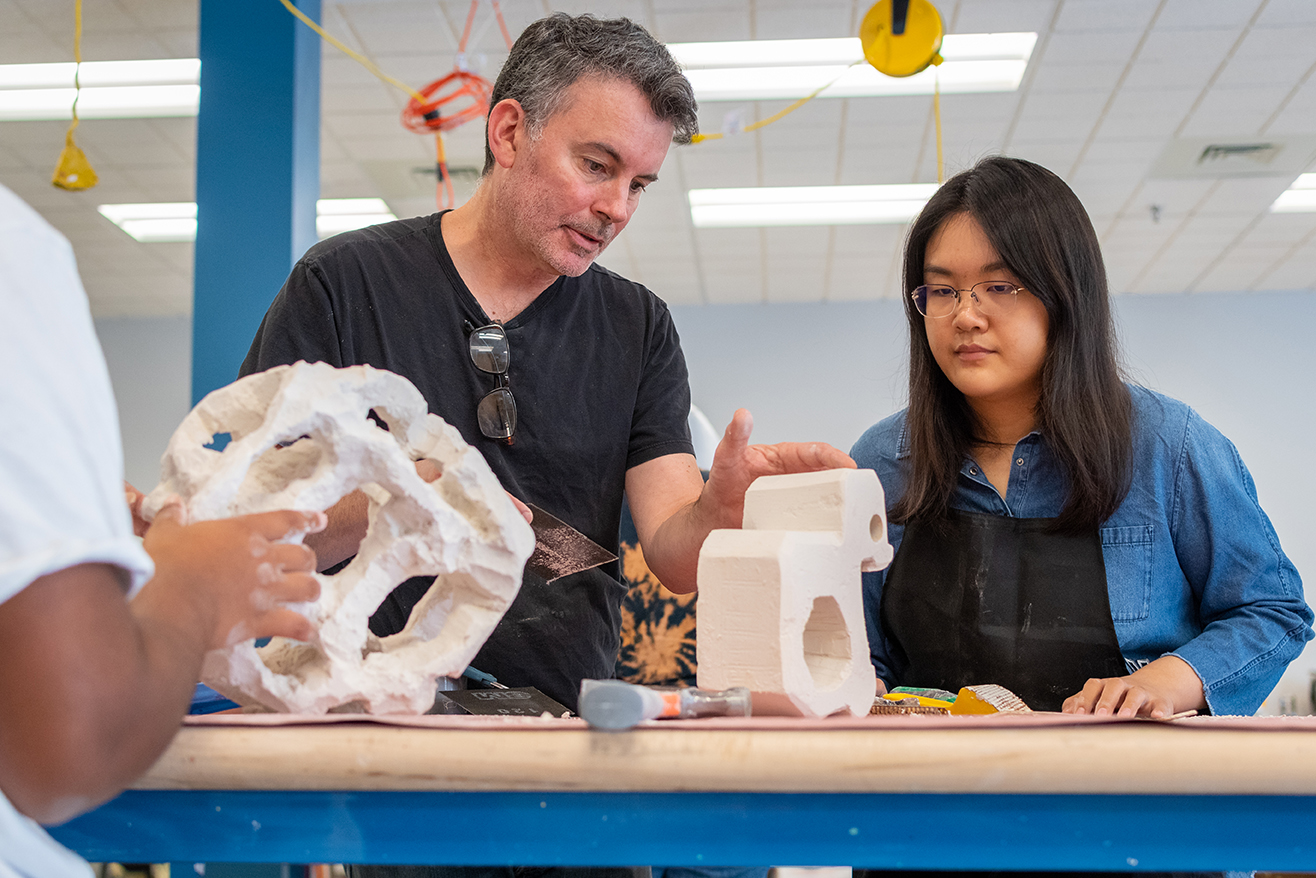 Professor and students work in new sculpture studio