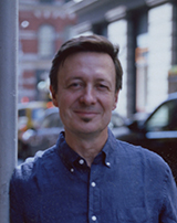 Higgins lecturer John Corbett on a street in Chicago