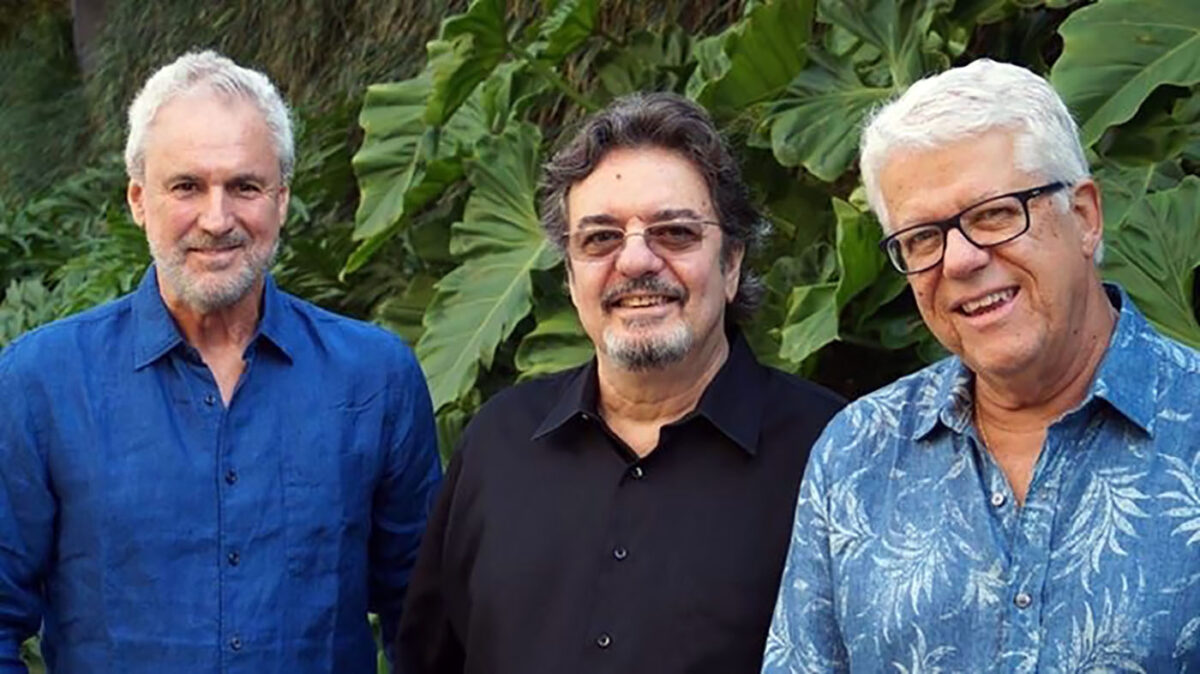 Three members of Trio da Paz standing