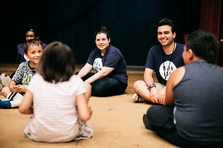 Brett Iarrabino works with students at Main IDEA