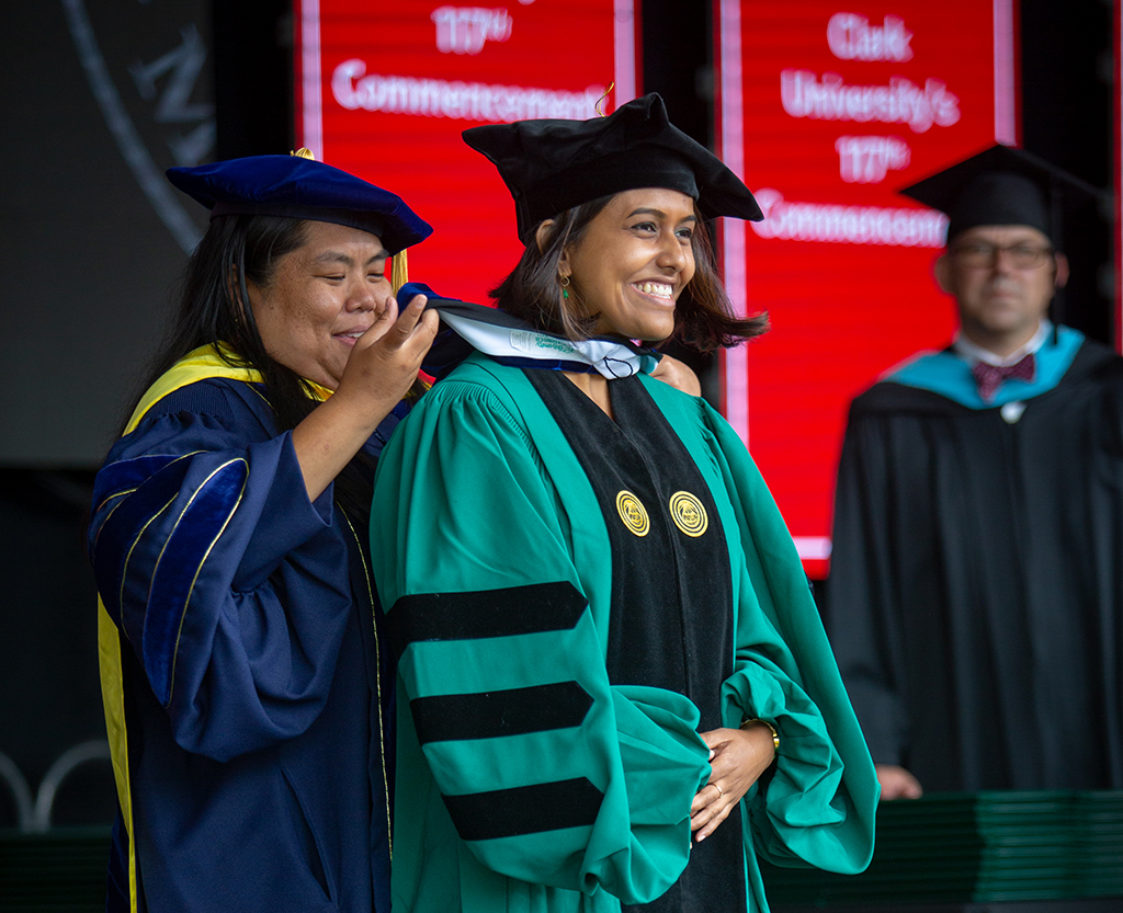Student receives doctoral hood during graduate Commencement ceremony