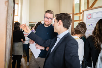 student presents poster