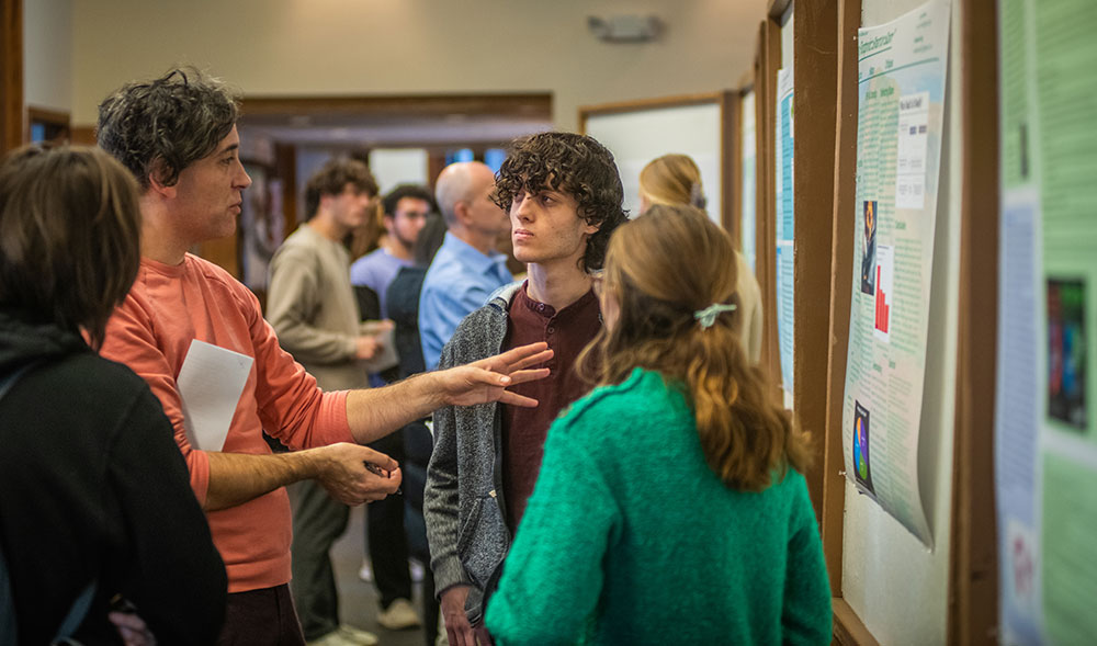Student showing poster