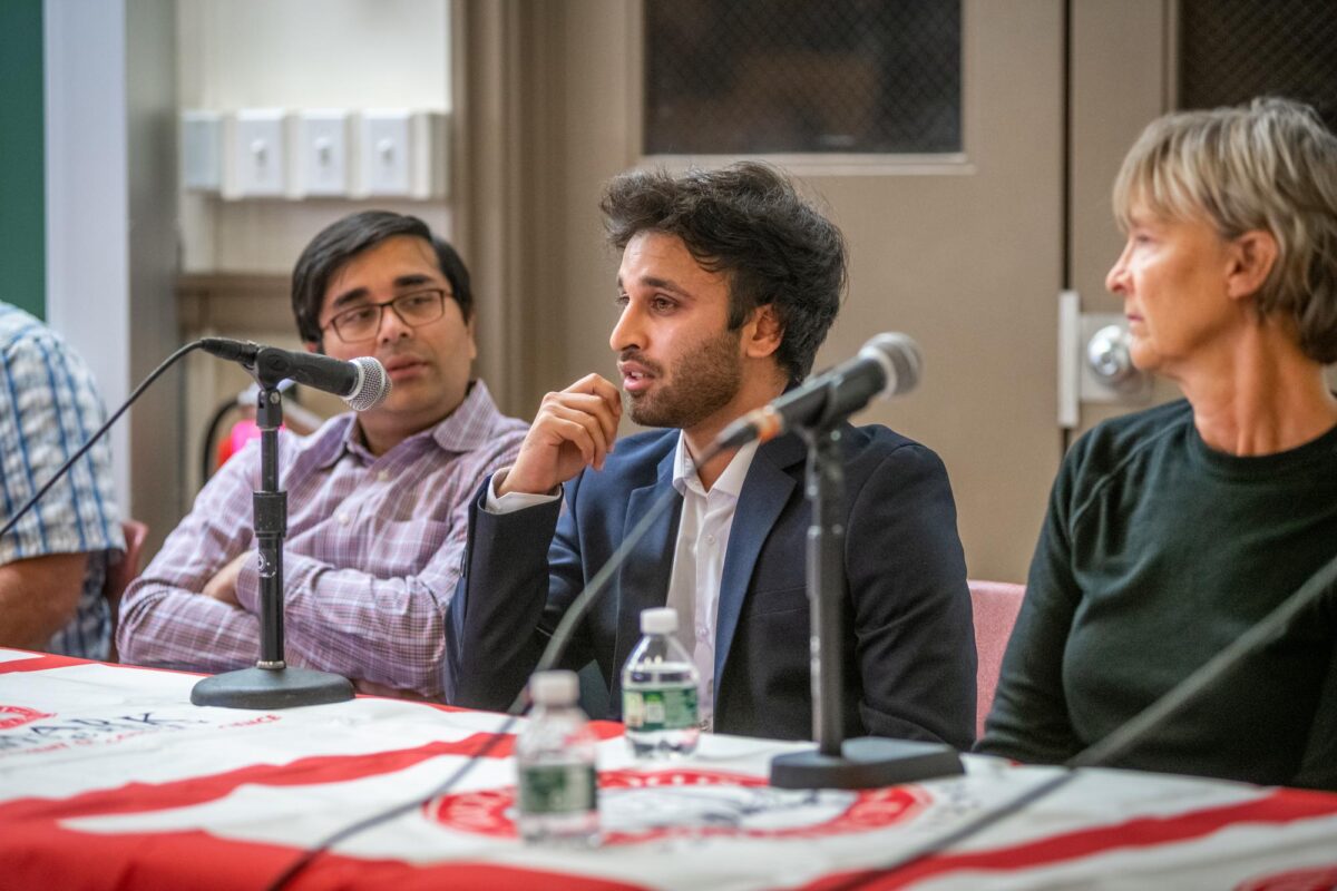 people at table with microphones