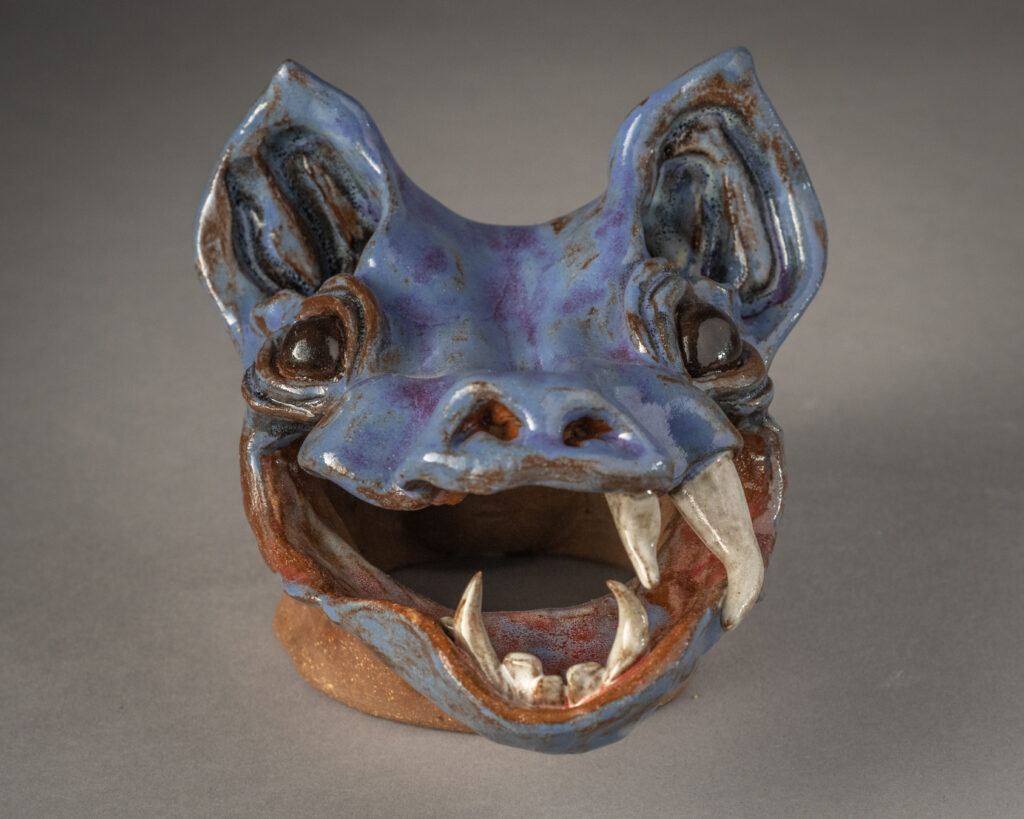 A clay gargoyle head made by Brynn Keevil '23