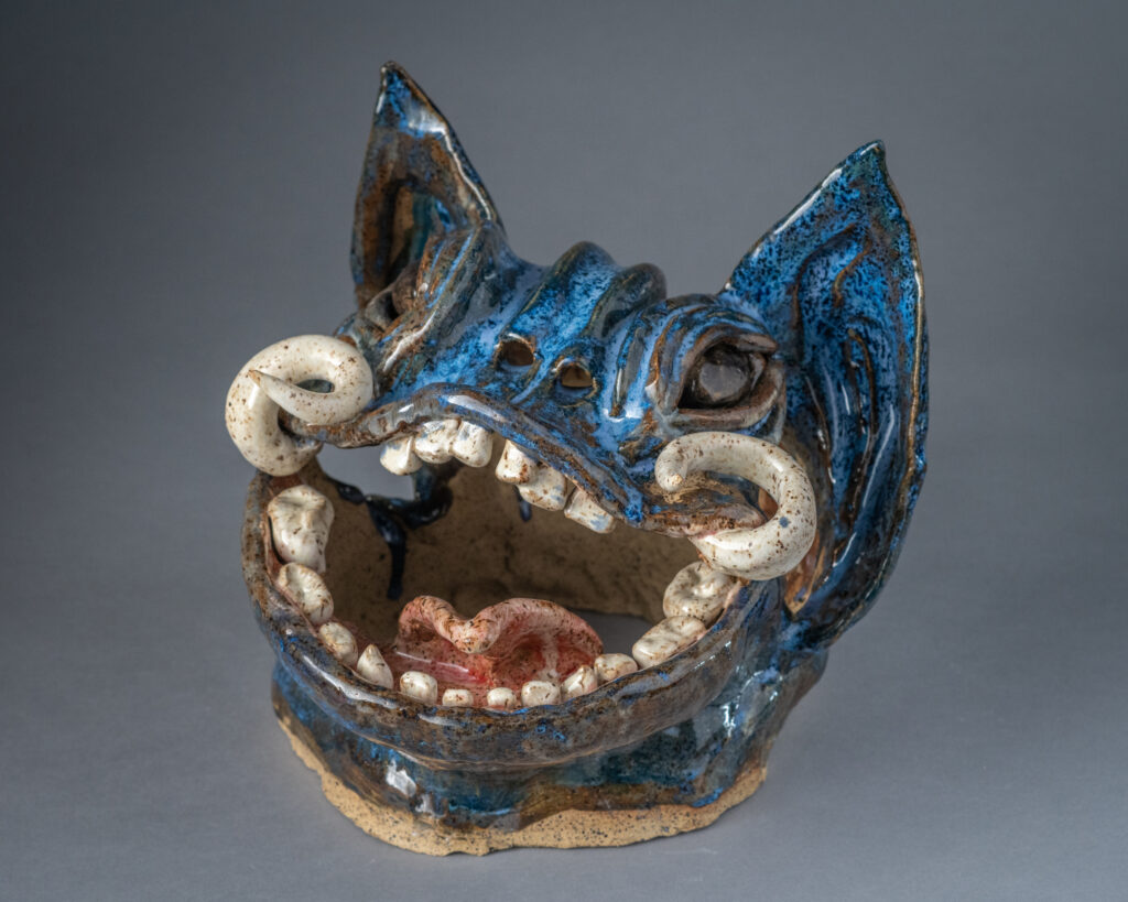 A clay gargoyle head made by Brynn Keevil '23
