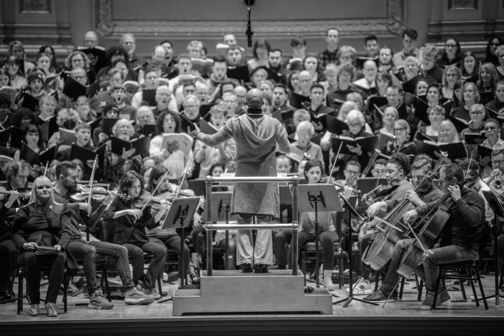 A full orchestra at a Carnegie hall performance