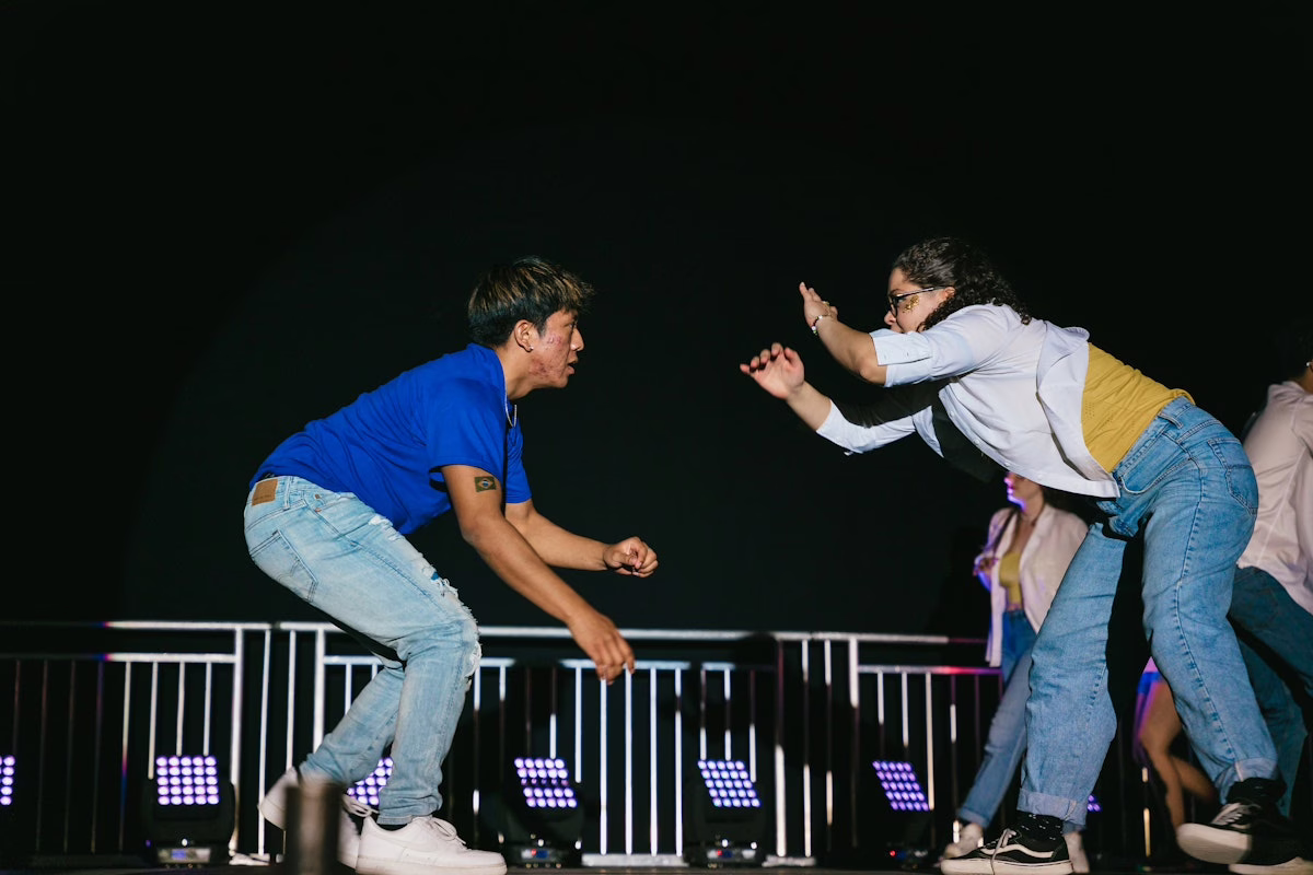 two people on stage dancing