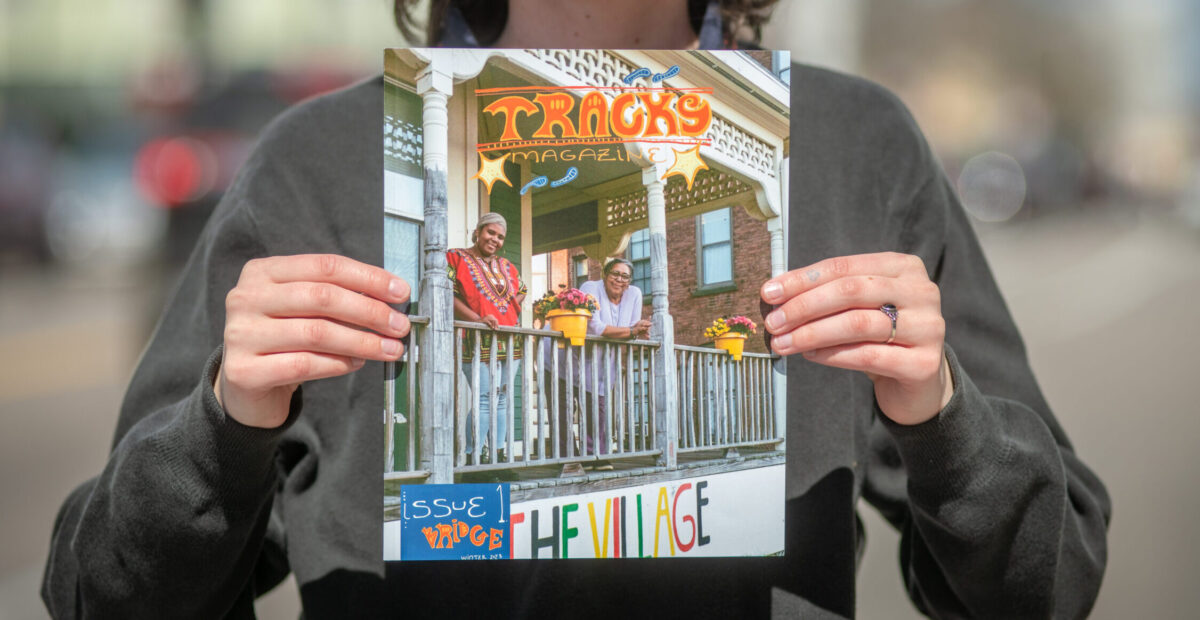 Sophie Gill ’23 with TRACKS Magazine in Worcester's Main South.