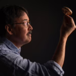 David Hibbett holding a mushroom