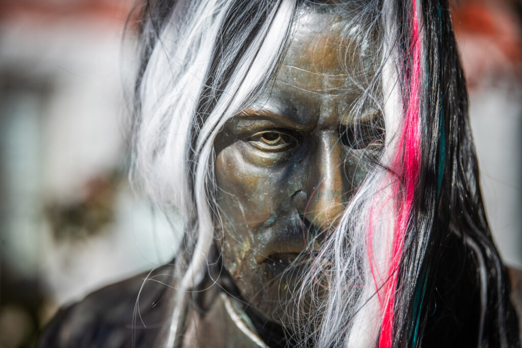 Sigmund Freud state with a multicolored halloween wig on Halloween