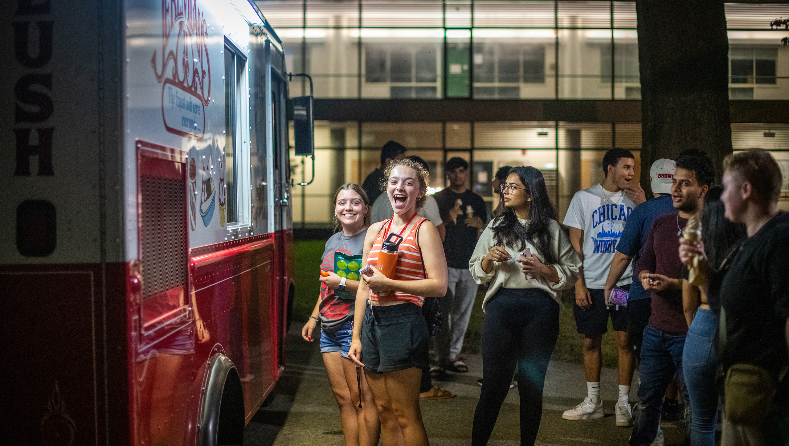 Clark students in line at a food truck during a Saturday evening event