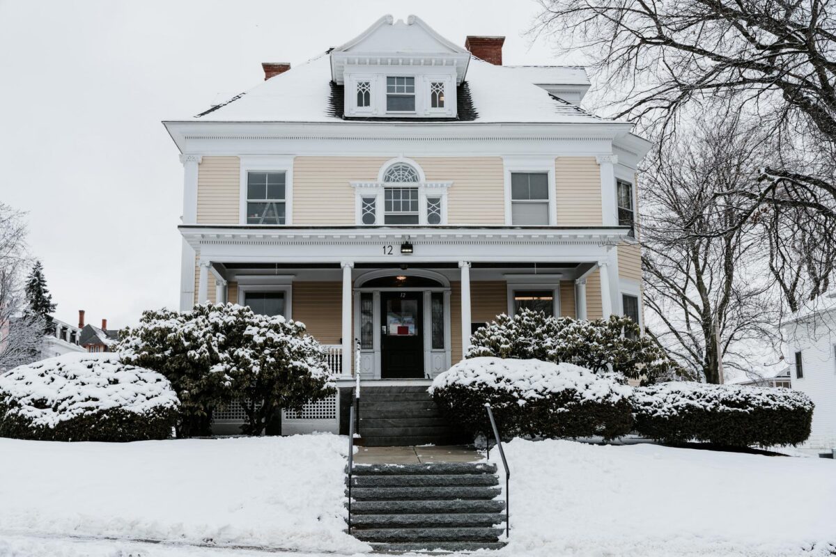 Yellow house in snow