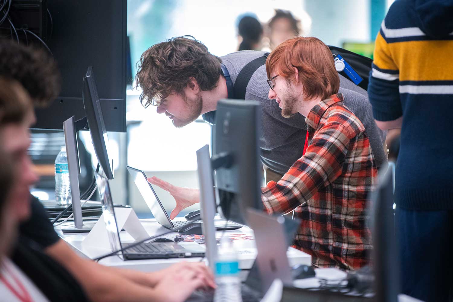 Students interacting with a game at the IGDA fall expo event at Clark