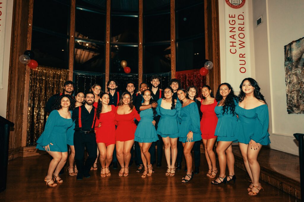 salsa dancers perform in hall